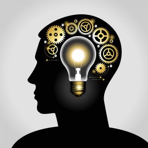 silhouette of a man's head with a glowing light bulb, and gears. the concept of making big idea. File is saved in AI10 EPS